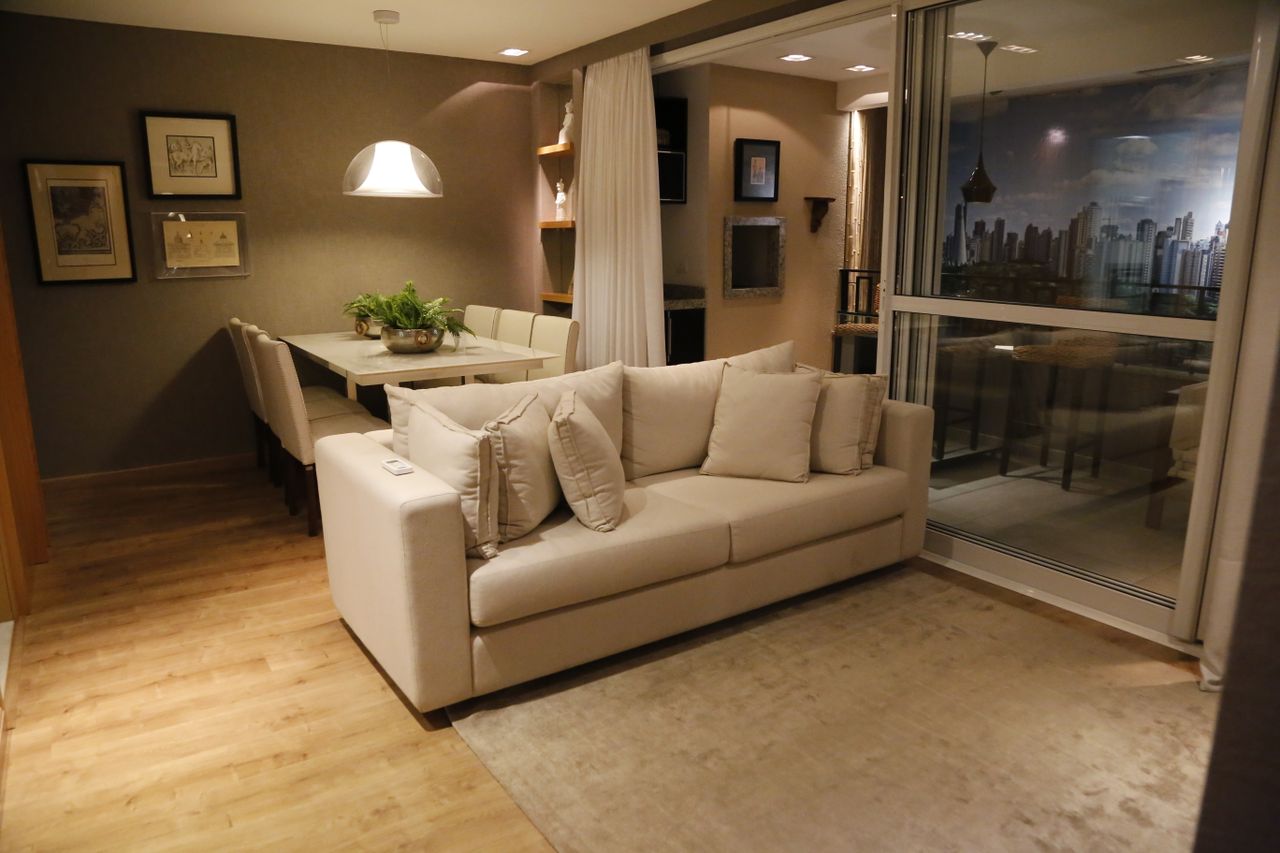 Cozy living room with modern furniture and dining area, perfect for stylish home interiors.